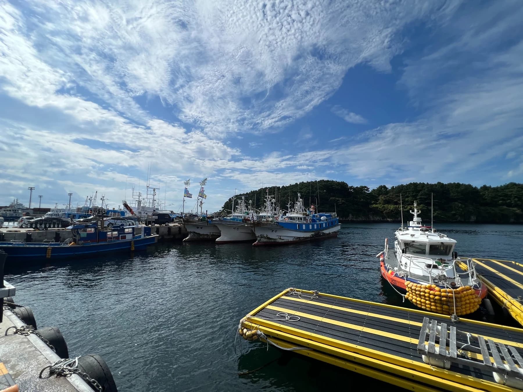 Boats and docks at Seogwipo Port before a dive