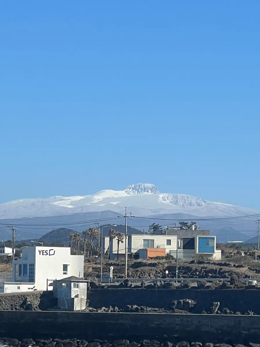 Panpo Port and snow-covered Hallasan on a clear winter day