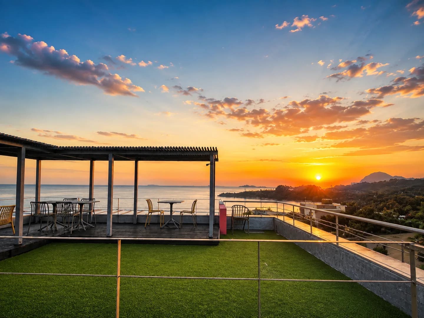 Orange sunset over the rooftop and sea at Witch’s Hill Jeju