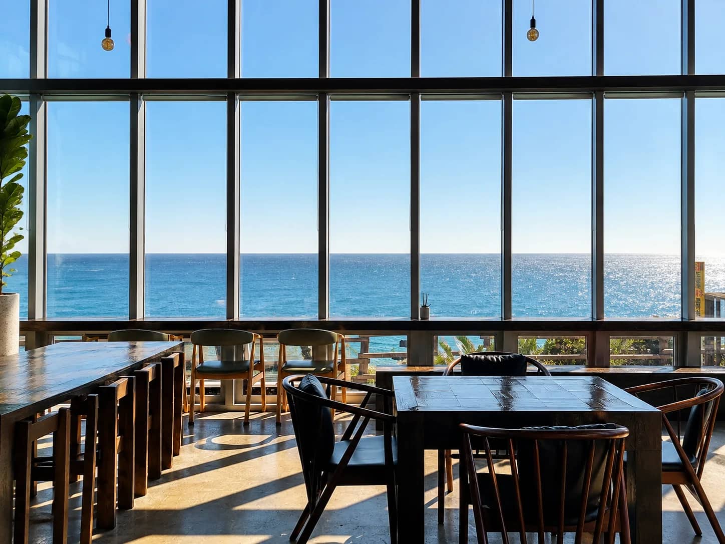 Sea view through the tall windows inside Witch’s Hill Jeju