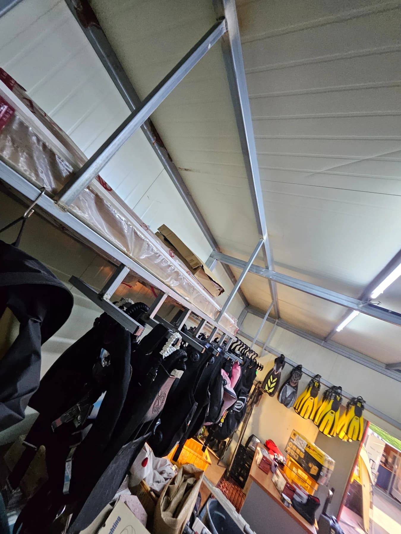 Wetsuits and scuba diving equipment stored at Wow Divers