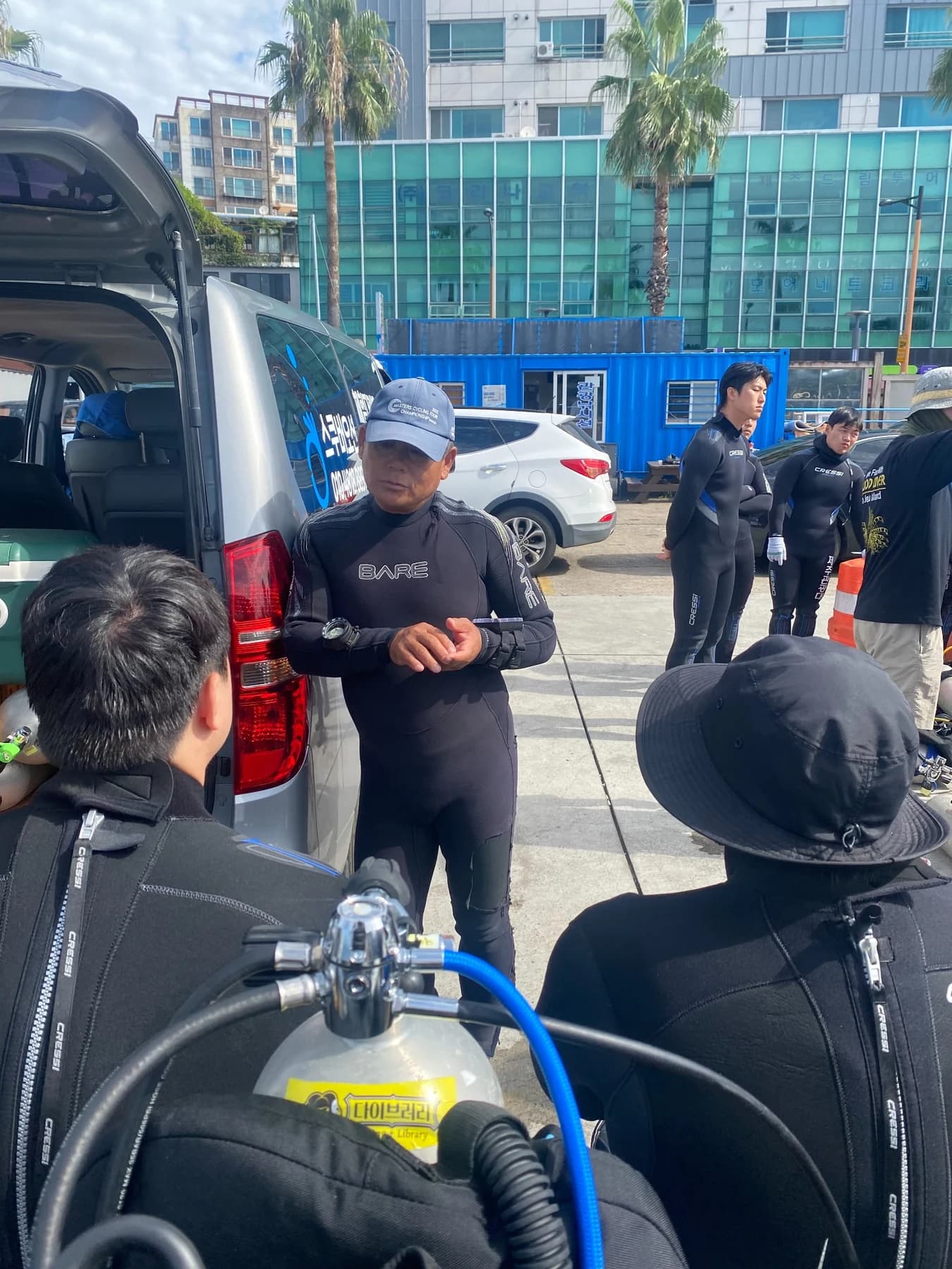 Divers listening to instructions before entering the water