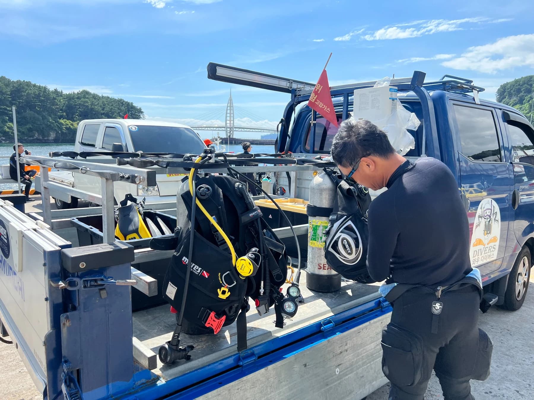 Tanks, BCDs and dive equipment being prepared at Seogwipo Port