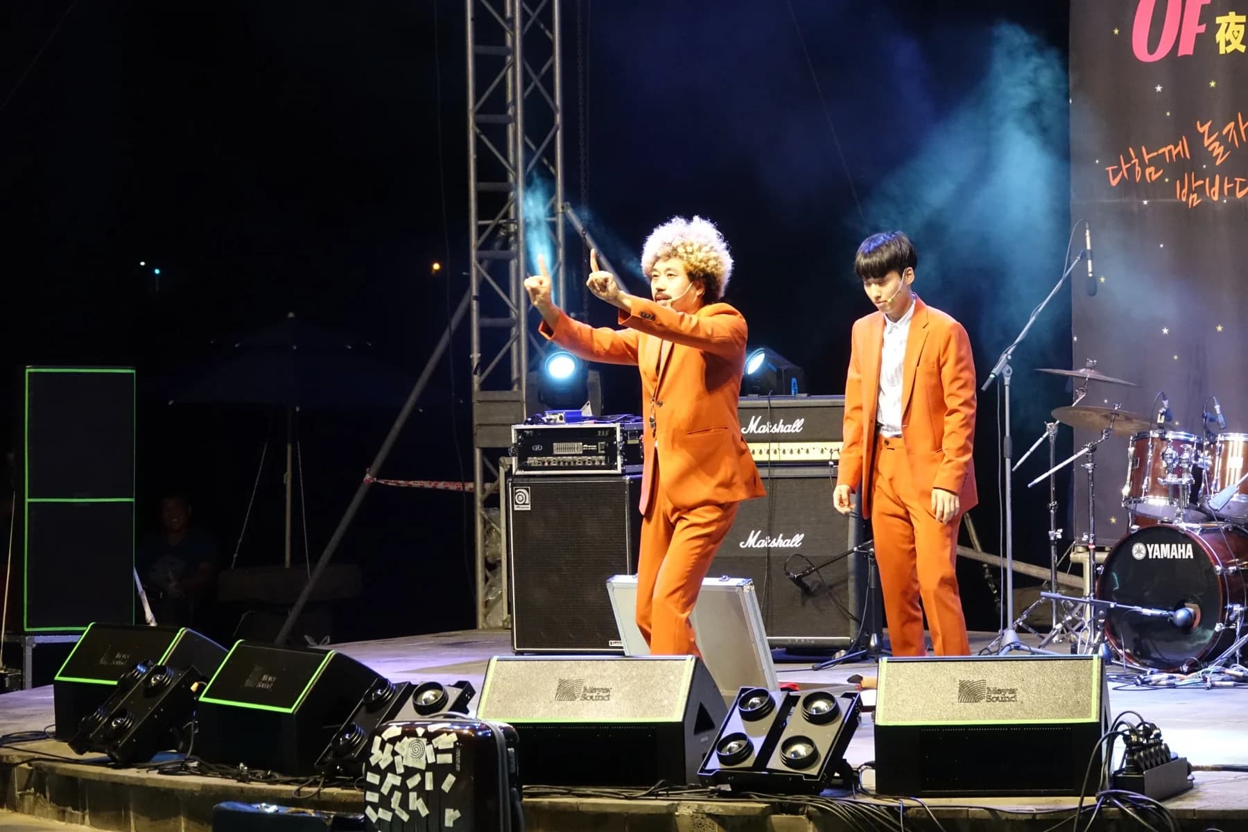 Lee Deokwon and the Boomhead performance team on an outdoor stage