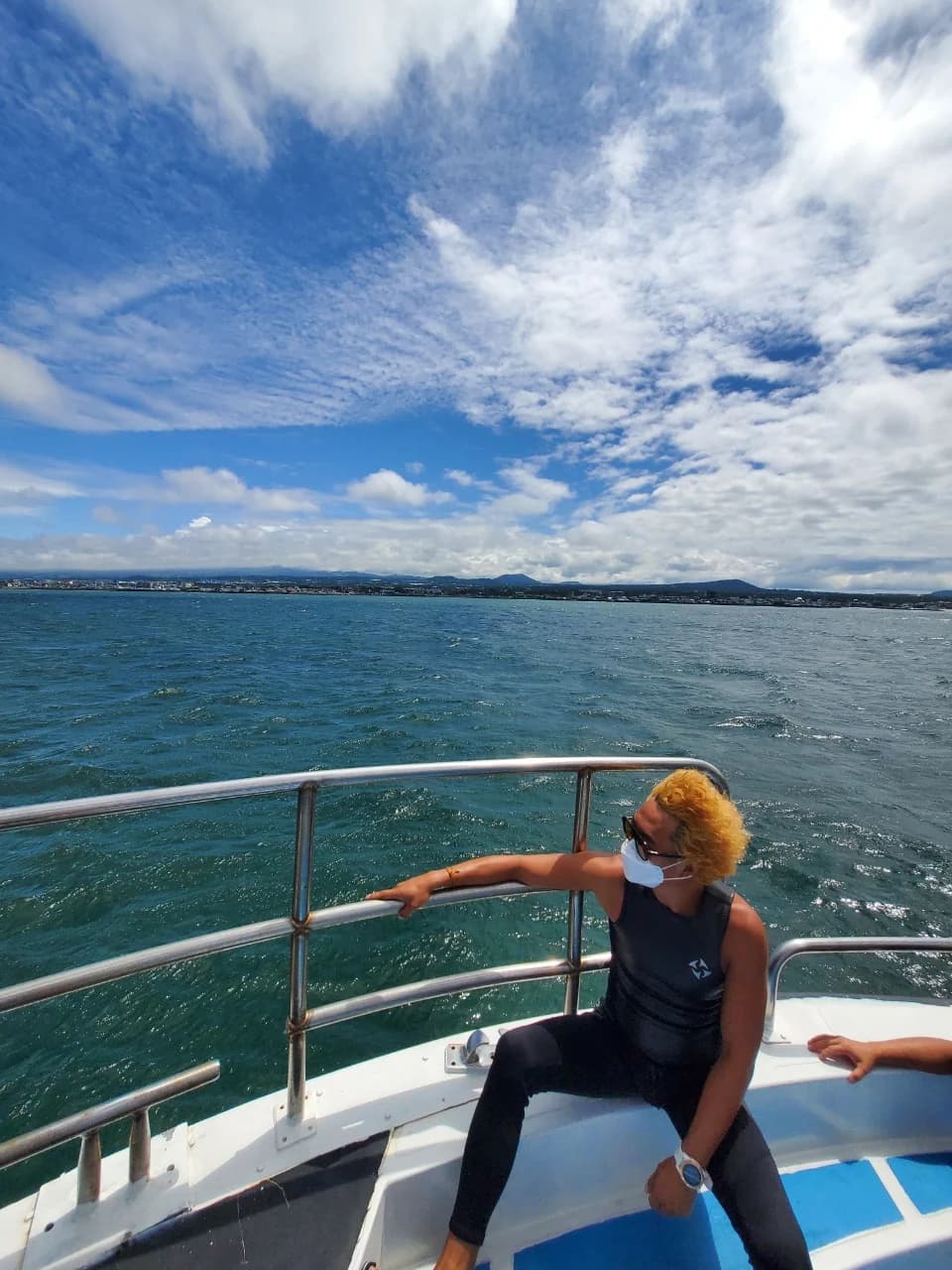 Lee Deokwon looking toward the Jeju coast from a boat
