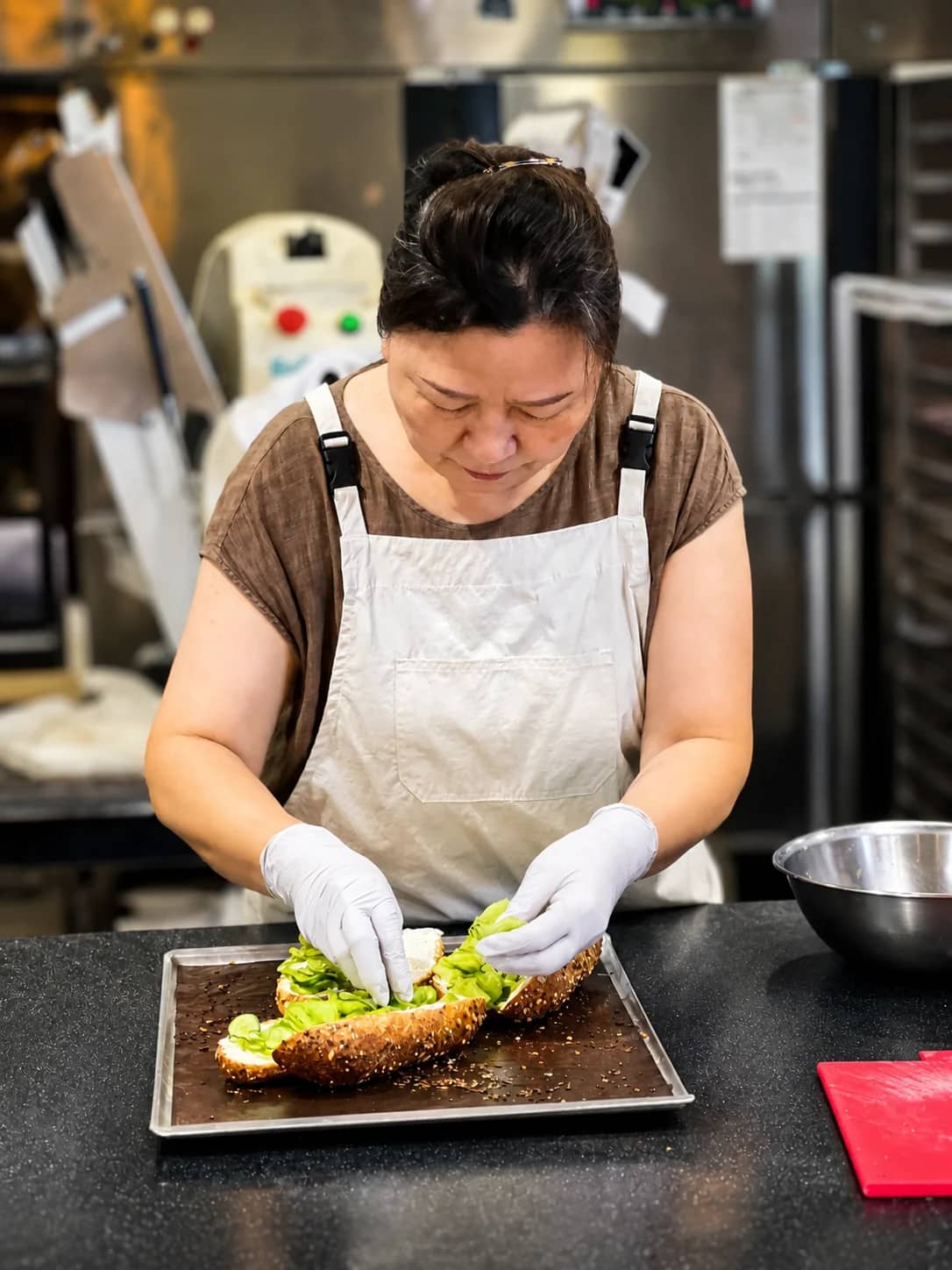 Lee Kyungsoon focused on preparing bread at her worktable