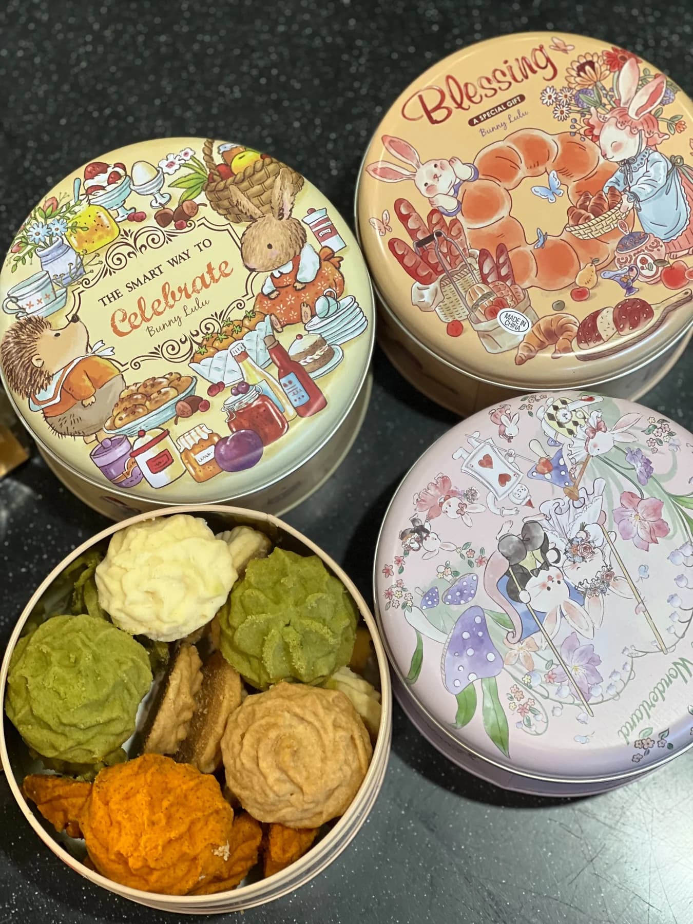Small baked goods arranged in tins at Fragrance Jeju