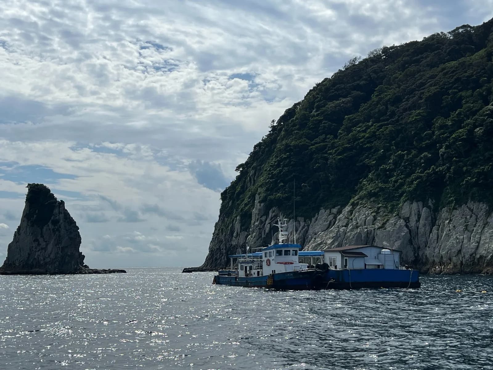 A small boat beneath the cliffs of Munseom