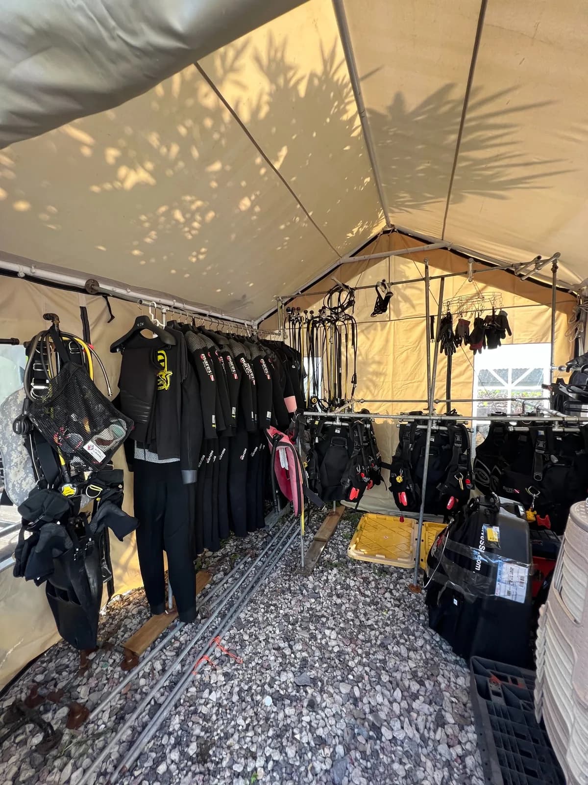 Scuba diving equipment arranged beneath a canopy before departure from Seogwipo Port